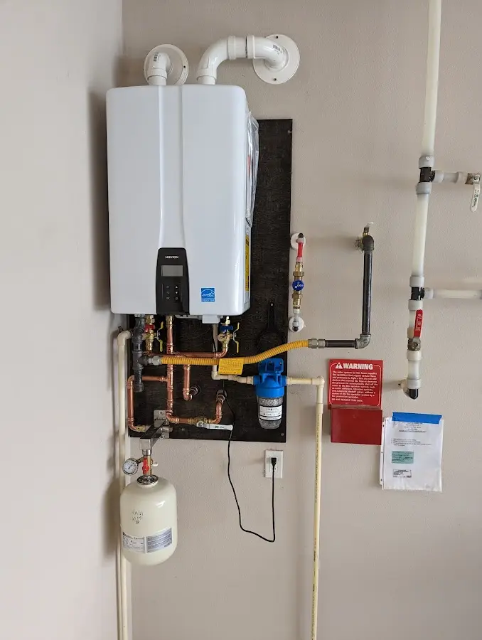 Professional plumber installing copper piping in a Hummelstown home